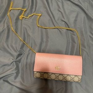 Pink Gucci wallet on a chain